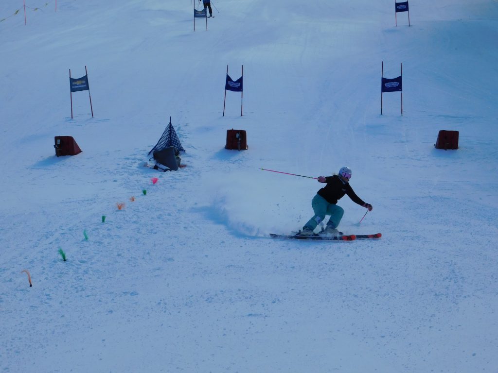 A woman skis well after taking ski lessons