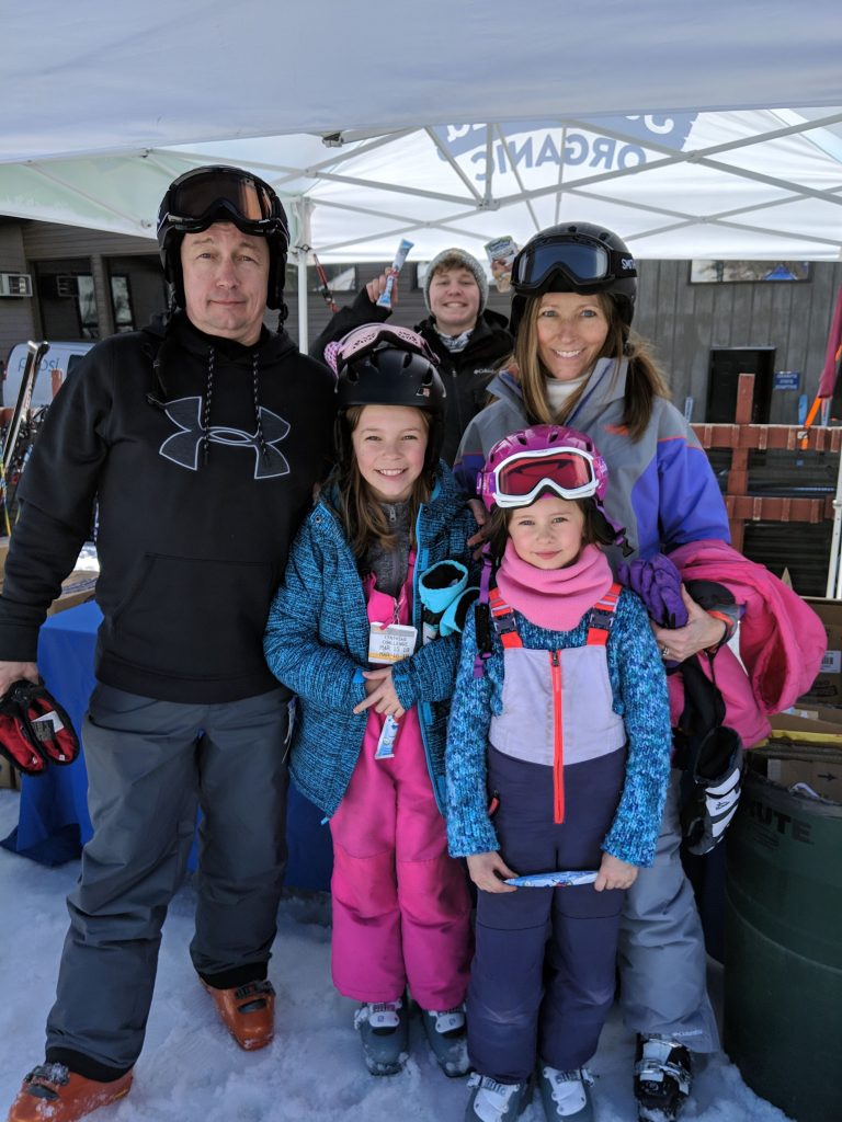 A family dresses in ski elements to stay warm