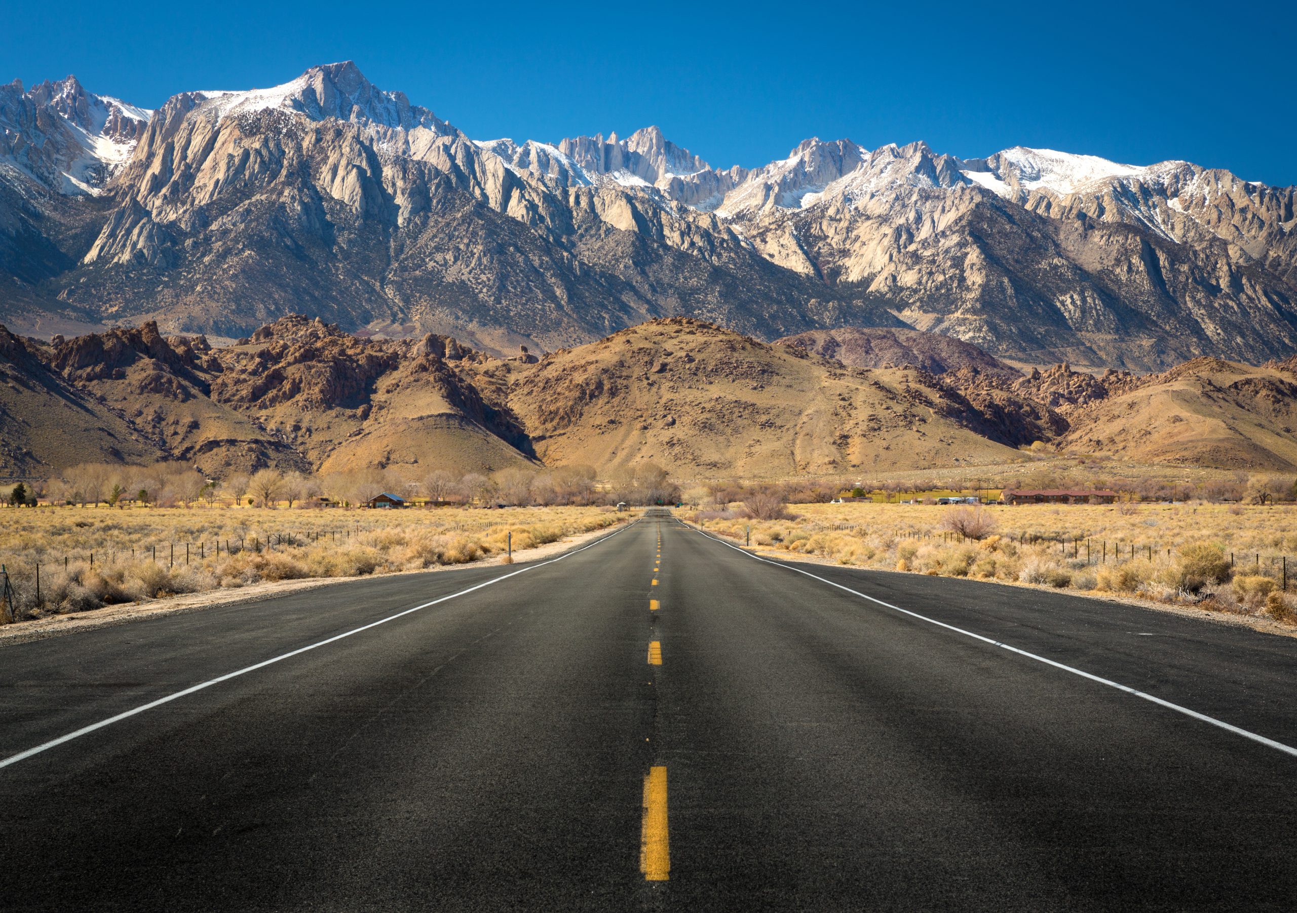 road with a beautiful mountain in the horizon