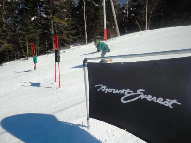 person skiing downhill at high speed